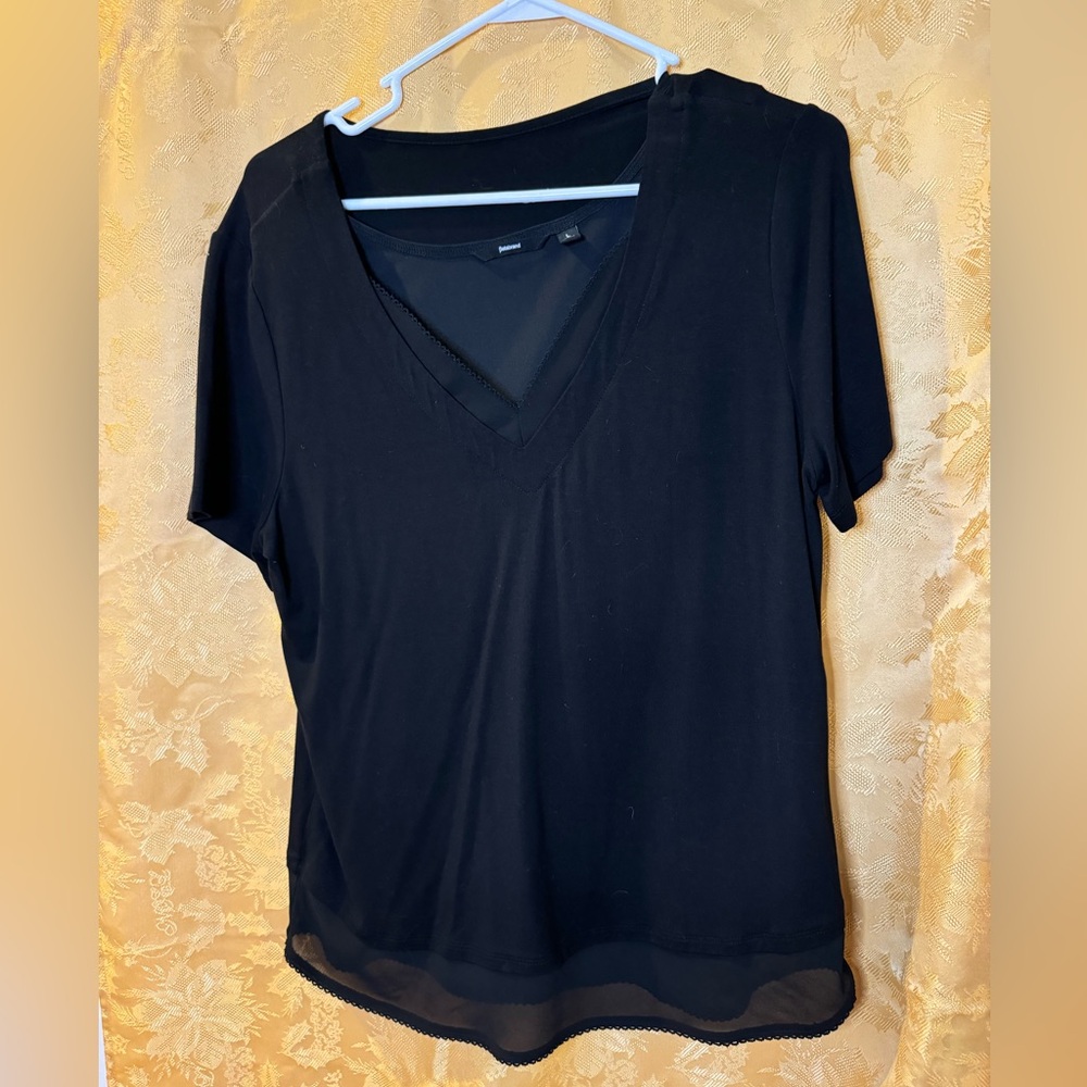 BETABRAND — Double layered, short-sleeved black tee with looped edging.